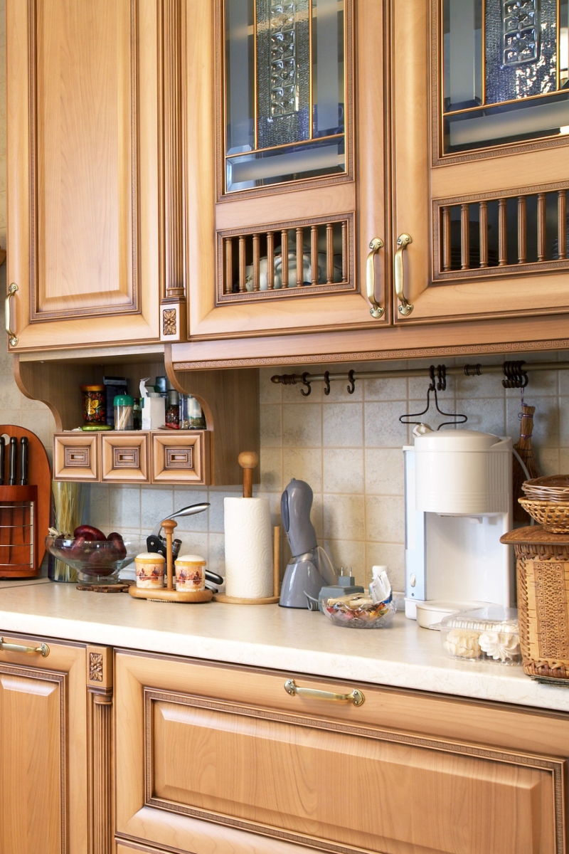 8 Kitchen with glass-fronted cabinets, a decorative tile backsplash, and a toaster on the countertop